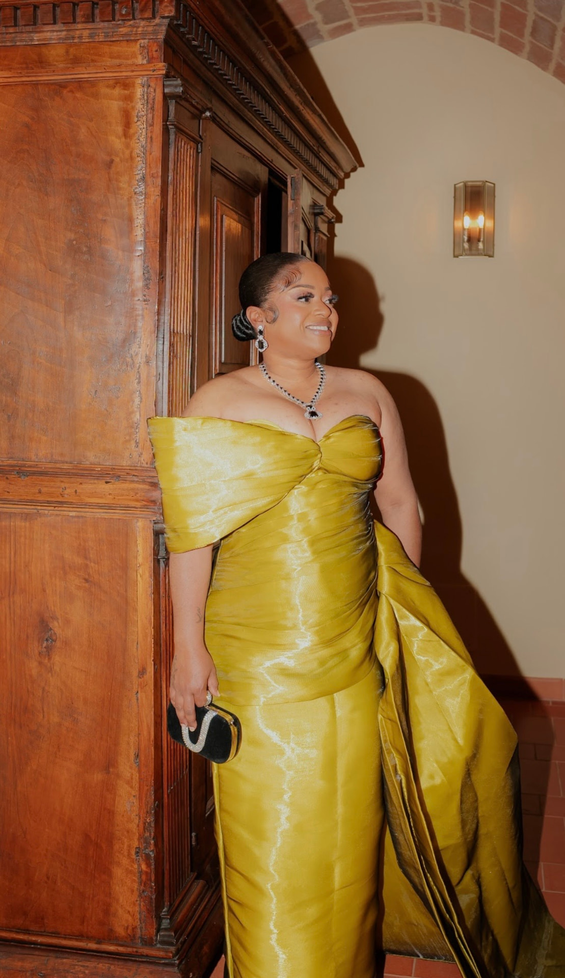 Serena in a gold evening gown