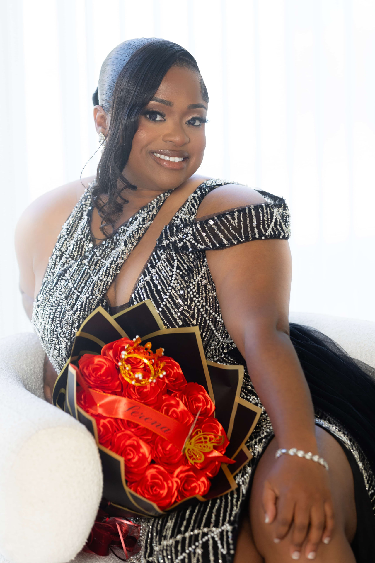 Serena celebrating in an elegant evening gown